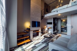 Grand Loft | Down comforters, desk, blackout drapes, soundproofing