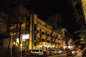 A multi-story building with a sign for "Crown Royale Hotel". - Crown Royale Hotel (Balanga)