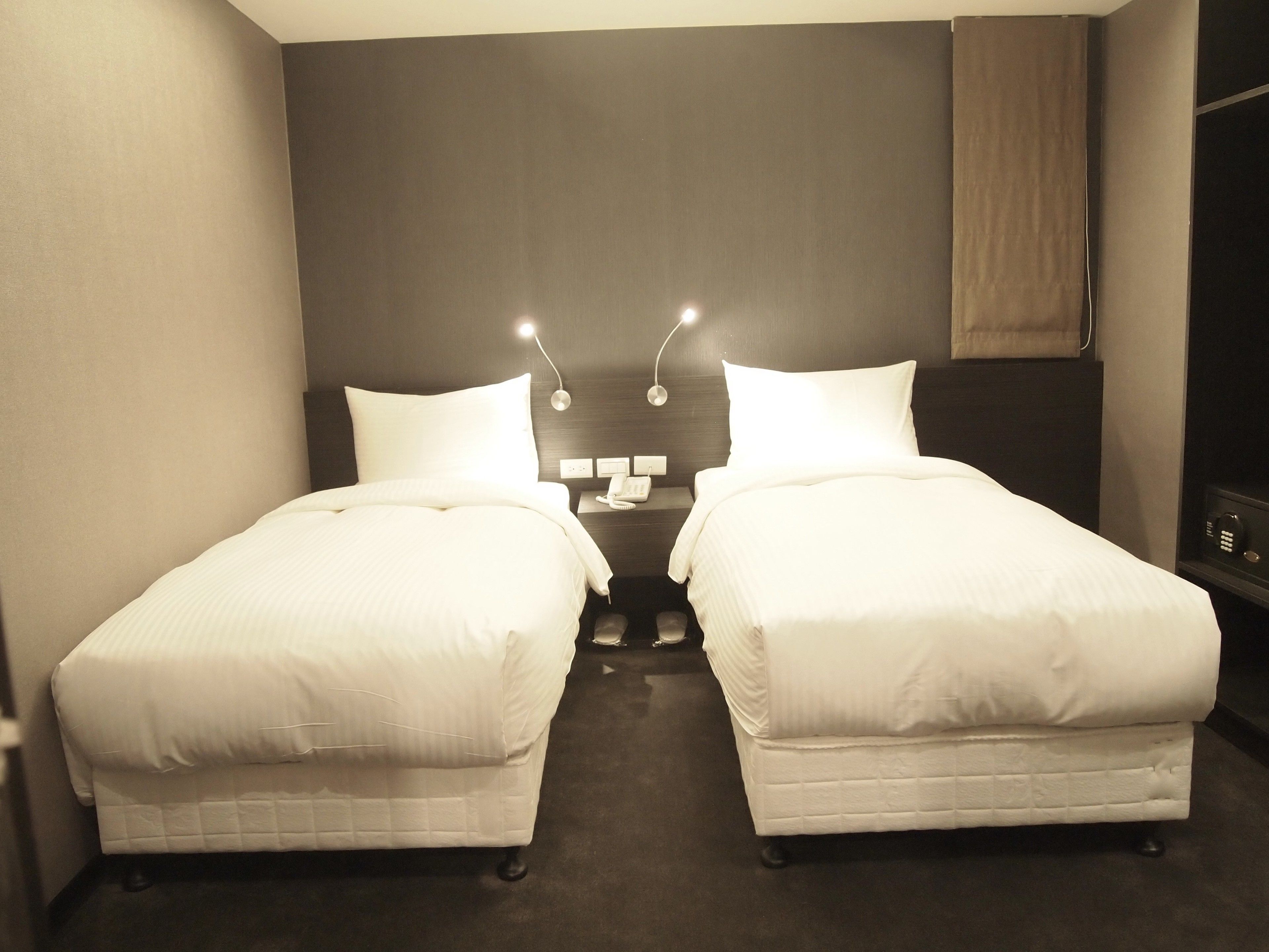 standard twin room | in-room safe, individually decorated, desk, blackout curtains