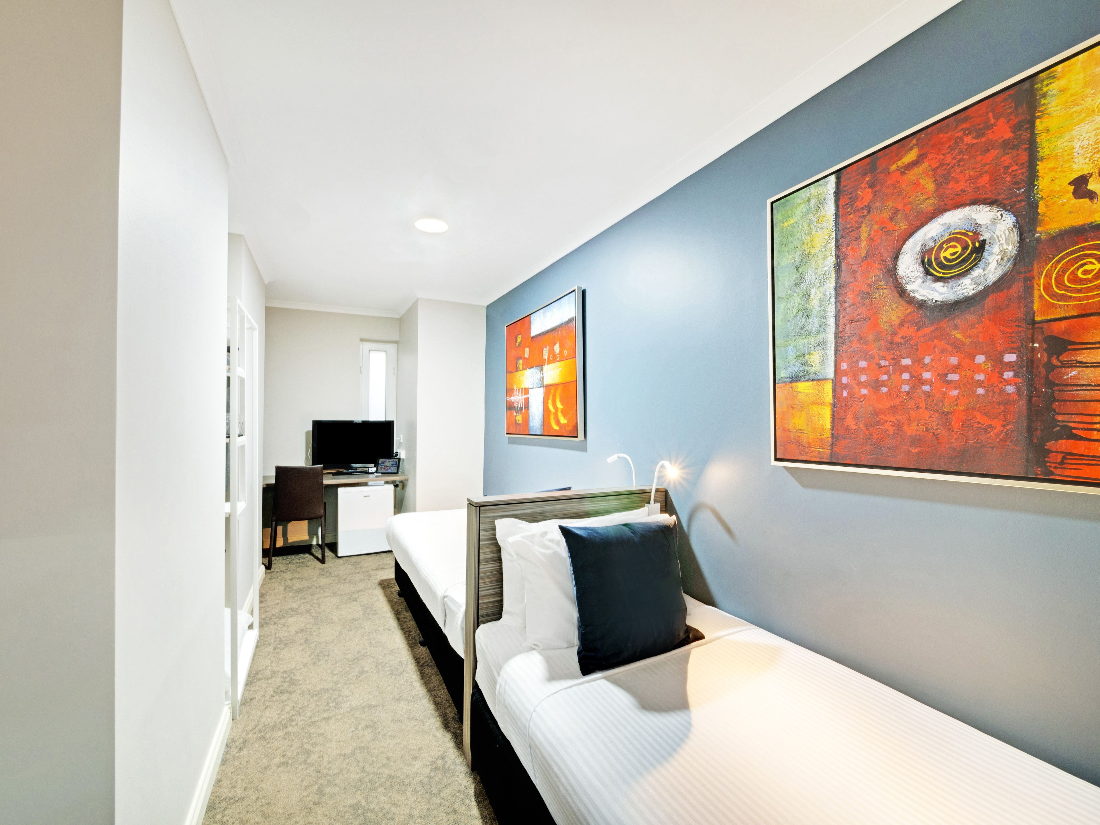 mini twin | desk, laptop workspace, iron/ironing board, free cots/infant beds