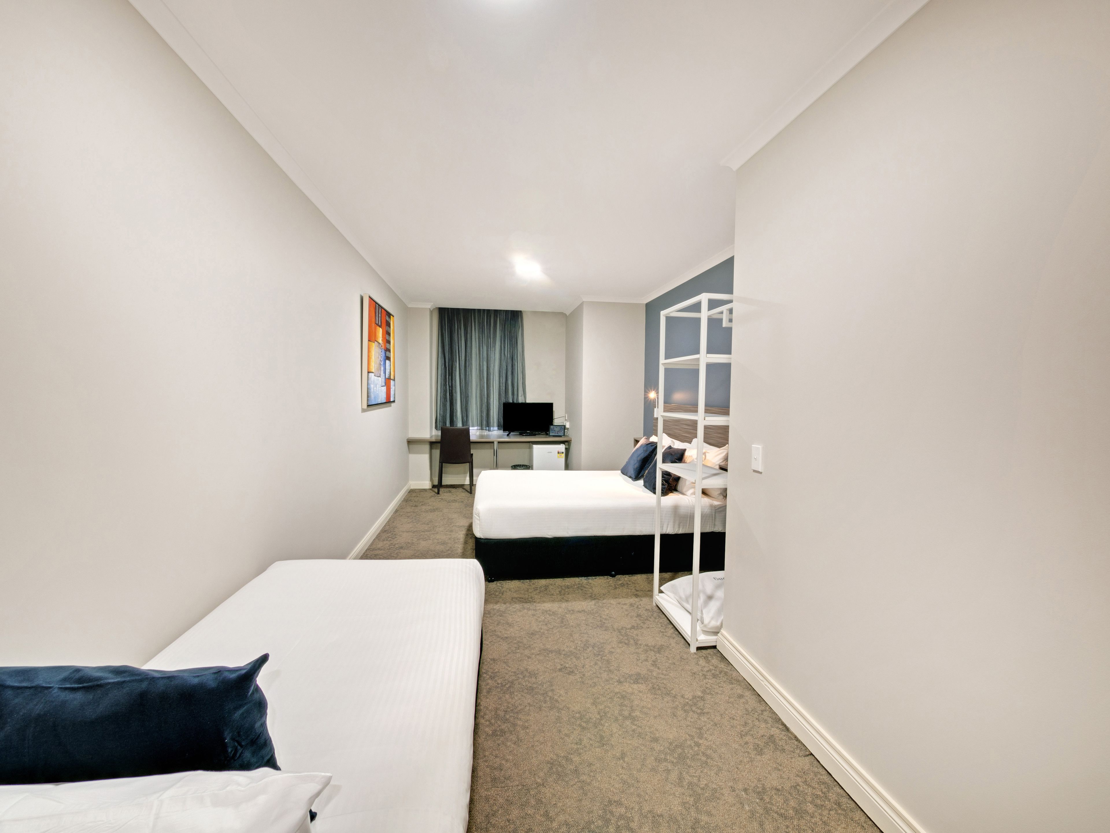 family room | desk, laptop workspace, iron/ironing board, free cots/infant beds