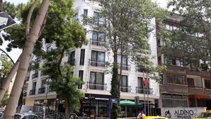 A multi-story hotel with balconies, a restaurant, and a sign for 'Aldino Residence'. - Aldino Residence (Ankara)