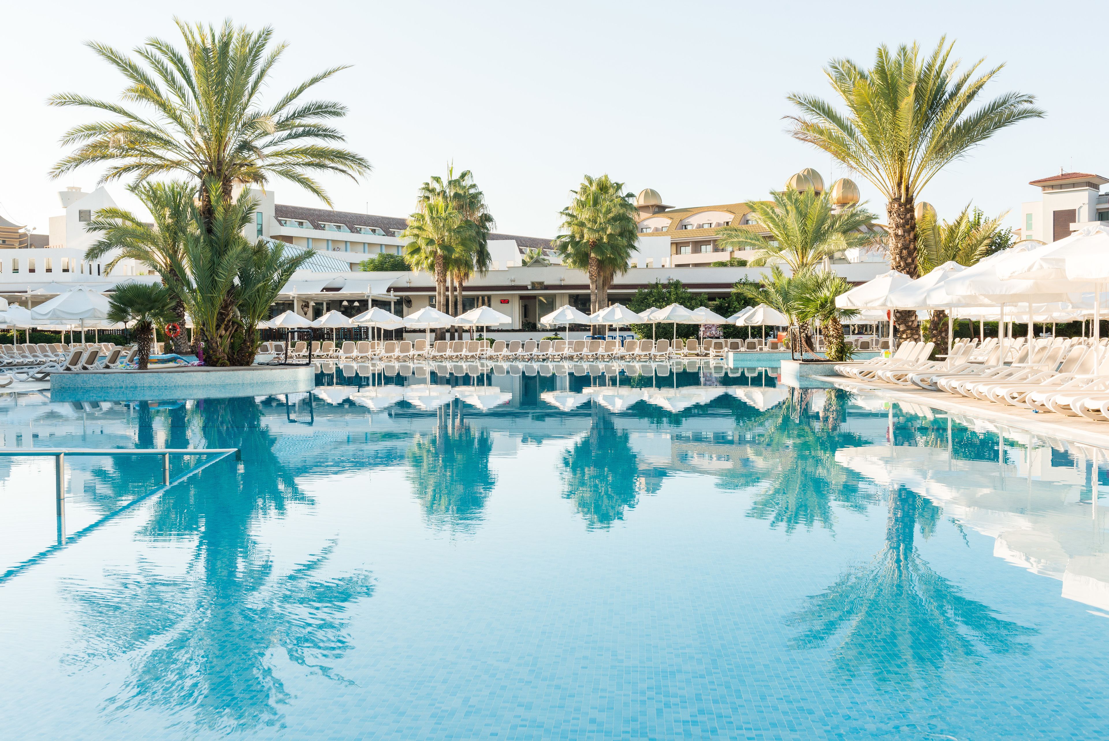 seasonal outdoor pool, pool umbrellas, pool loungers