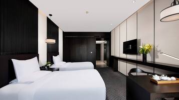 Twin Room | 1 bedroom, in-room safe, desk, blackout curtains