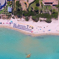 On the beach, sun-loungers, beach bar