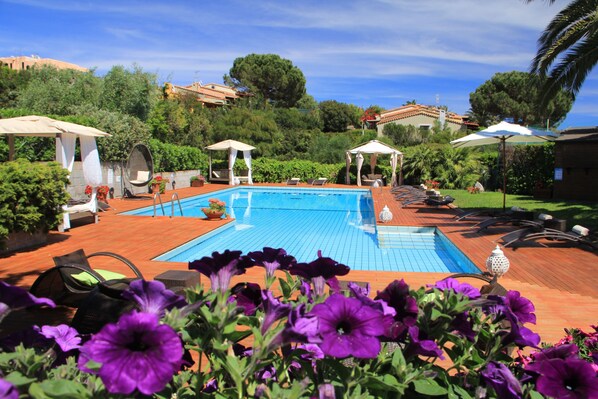 Seasonal outdoor pool, pool umbrellas, pool loungers