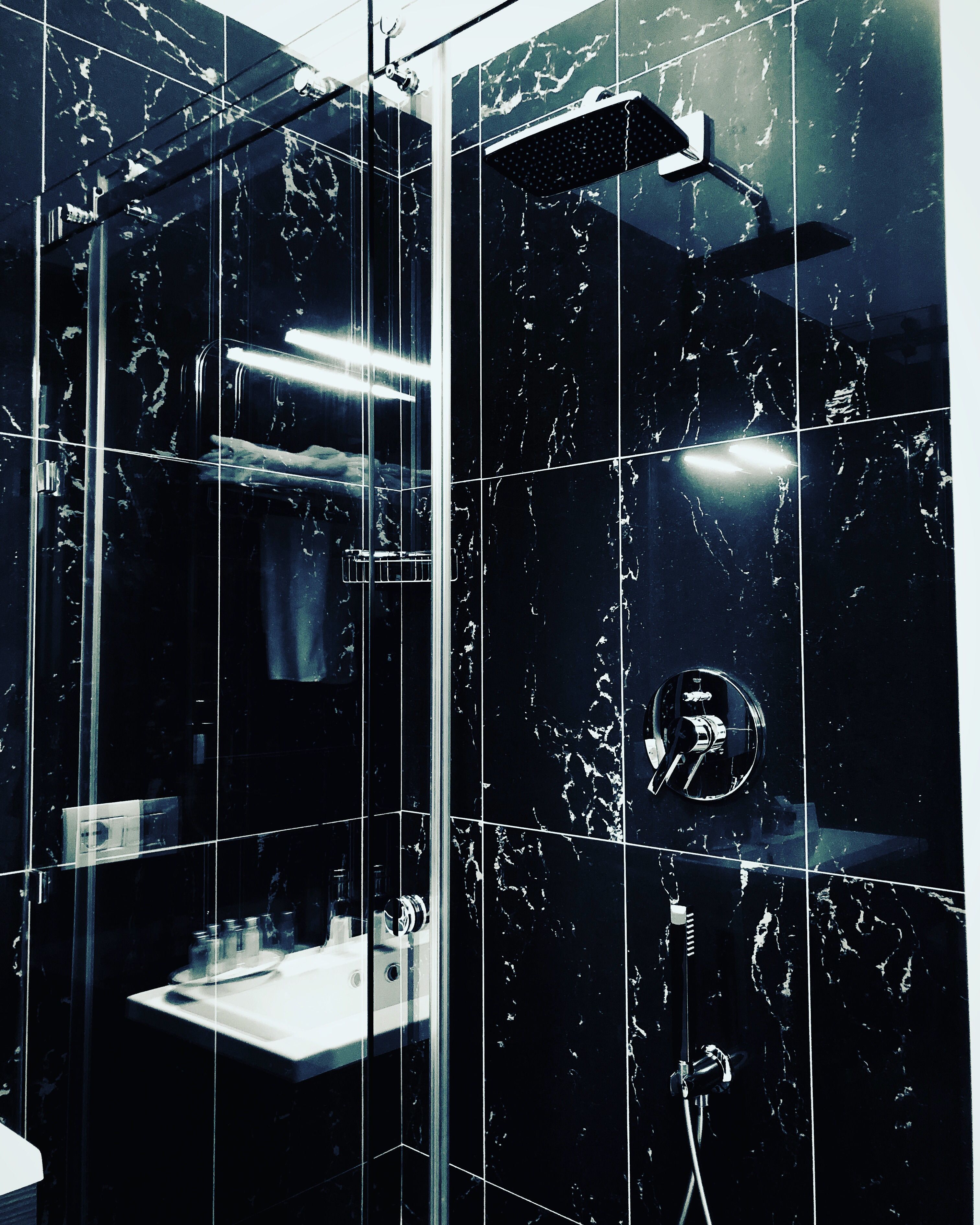 shower, designer toiletries, hair dryer, slippers