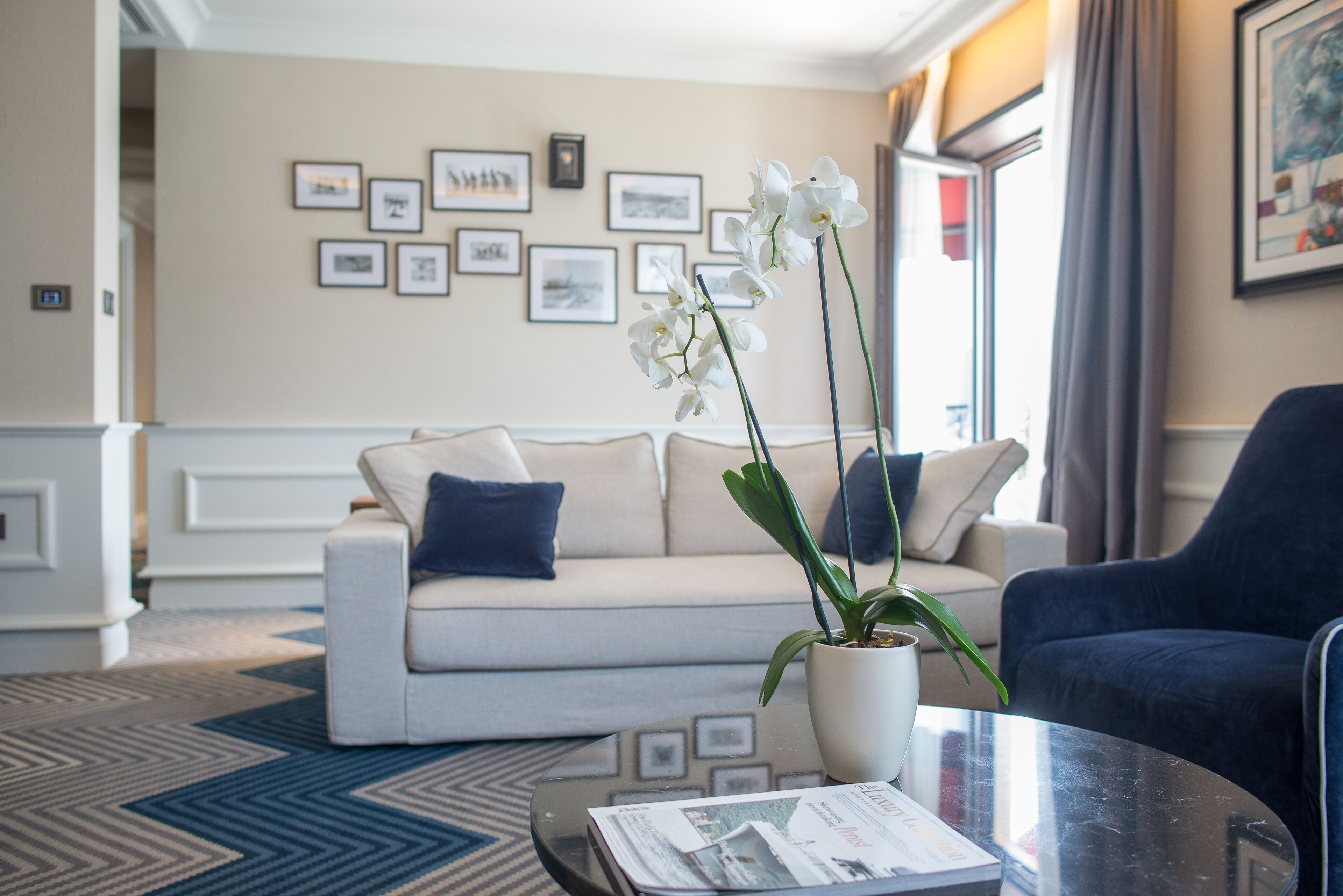 deluxe two-bedroom suite with sea view | living room | flat-screen tv