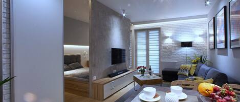 Comfort Suite, Non Smoking, Balcony | Living room | Flat-screen TV