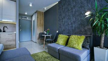 Comfort Studio, 1 Queen Bed with Sofa bed, Balcony | Living area | Flat-screen TV