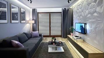 Comfort Apartment, Balcony, Courtyard View | Living room | Flat-screen TV