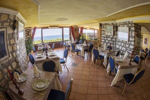 Breakfast, lunch, dinner served; local cuisine 