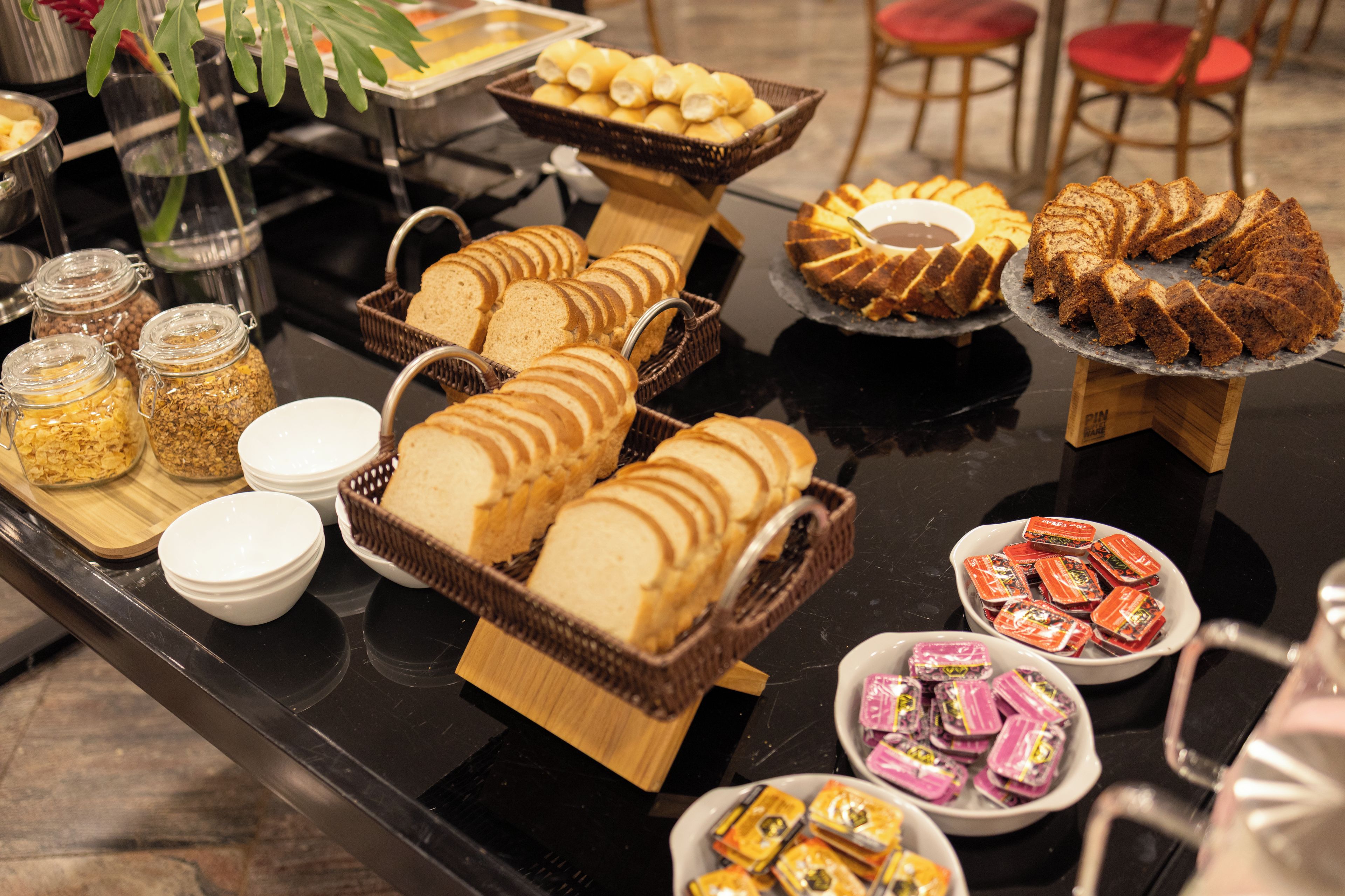 A buffet table with various food items and containers.