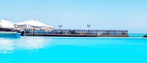 2 outdoor pools, pool umbrellas, pool loungers