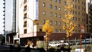 A multi-story hotel building with a sign indicating it is a hotel. - Toyoko Inn Shin Yokohama Station Shinkan (Yokohama)