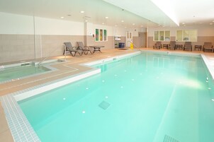 Indoor pool, open 7 AM to 10:00 PM, pool loungers