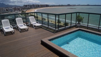 Indoor pool, outdoor pool, pool umbrellas, pool loungers