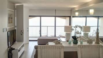 Family Apartment, 3 Bedrooms | Living area | Flat-screen TV