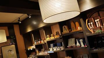 A traditional Japanese store with shelves of ceramics and decorative items.