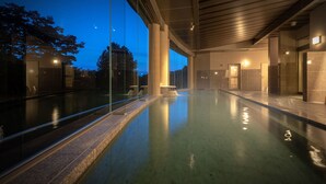 A modern indoor swimming pool with clear glass walls, a tiled floor, and a wooden ceiling. - Zao Onsen Zao Shiki No Hotel (Yamagata)