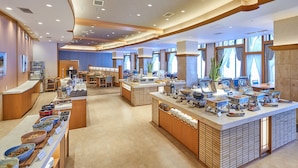 A spacious hotel lobby with a central reception desk, multiple seating areas, and a buffet counter with various food items. - Zao Onsen Zao Shiki No Hotel (Yamagata)