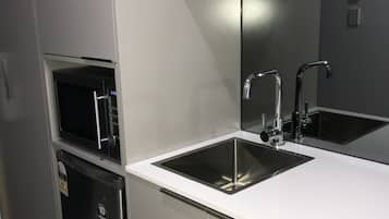 Fridge, microwave, cookware/dishes/utensils