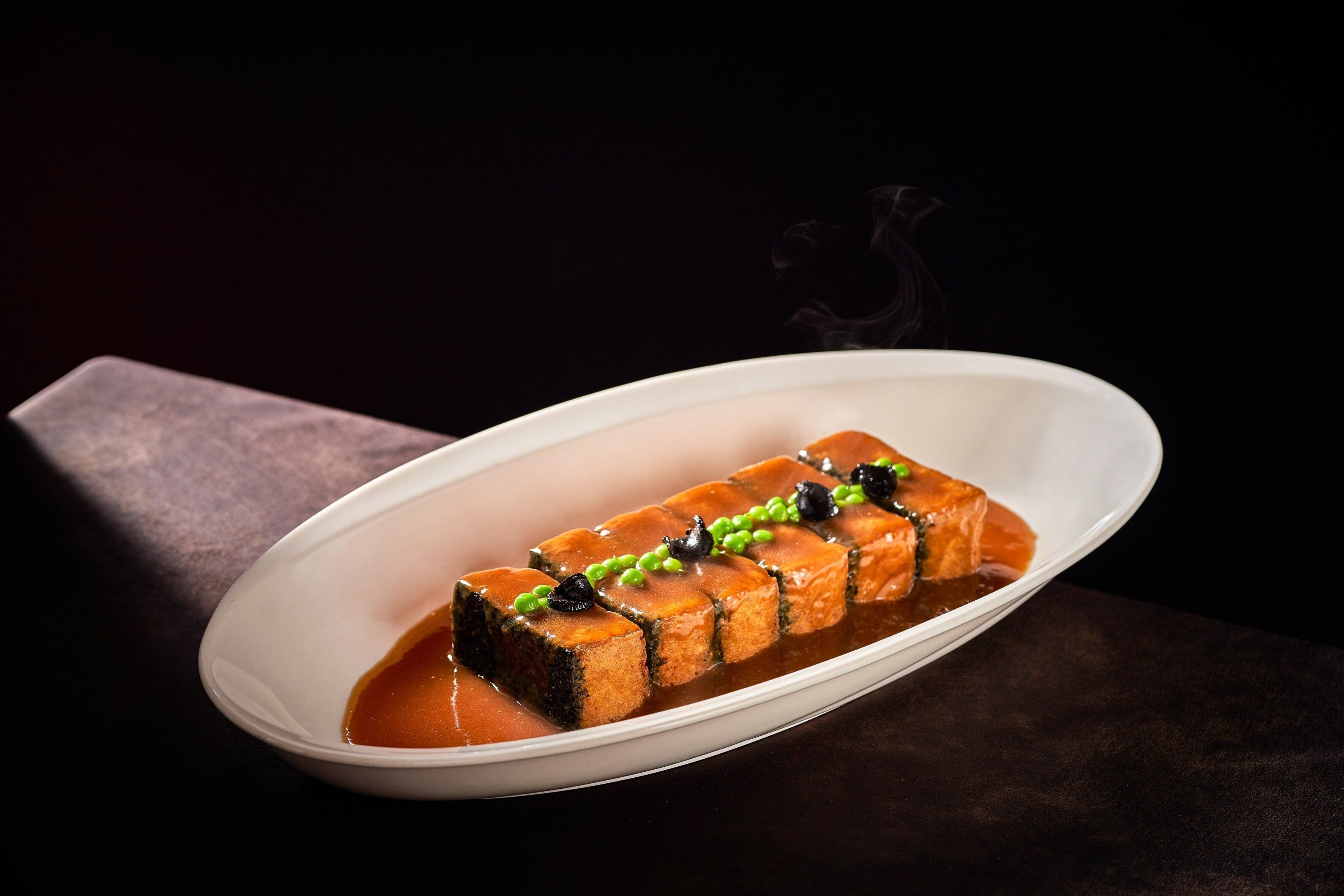 A dish of sushi on a white plate.
