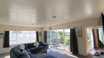Family House, 4 Bedrooms, Partial Ocean View | Living area | Flat-screen TV