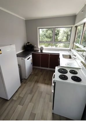 Family House, 2 Bedrooms, Partial Ocean View | Private kitchen | Full-size fridge, microwave, oven, stovetop - Waitangi Beach House (Paihia)
