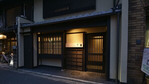 A traditional Japanese building with a sliding door and a small entrance. - Kuraya Kamigojo-cho (Kyoto)