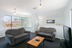 50-inch flat-screen TV with digital channels, TV, DVD player