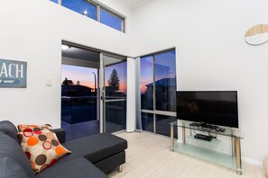 50-inch flat-screen TV with digital channels, TV, DVD player - Reflections by Rockingham Apartments (Rockingham)