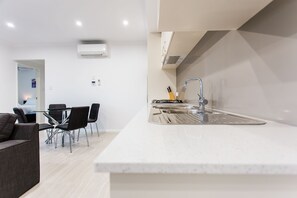 50-inch flat-screen TV with digital channels, TV, DVD player - Reflections by Rockingham Apartments (Rockingham)