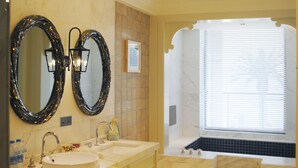 A bathroom with two large mirrors, a bathtub, and a window with blinds. - Huaqing Aegean Inter Hot Spring Resort (Xi'an)