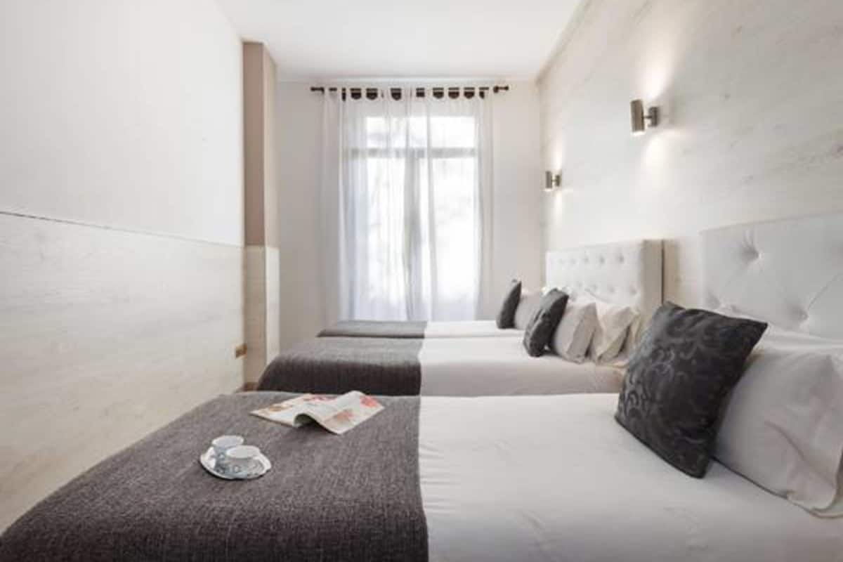 Luxe beddengoed, een kluis op de kamer, een strijkplank/strijkijzer