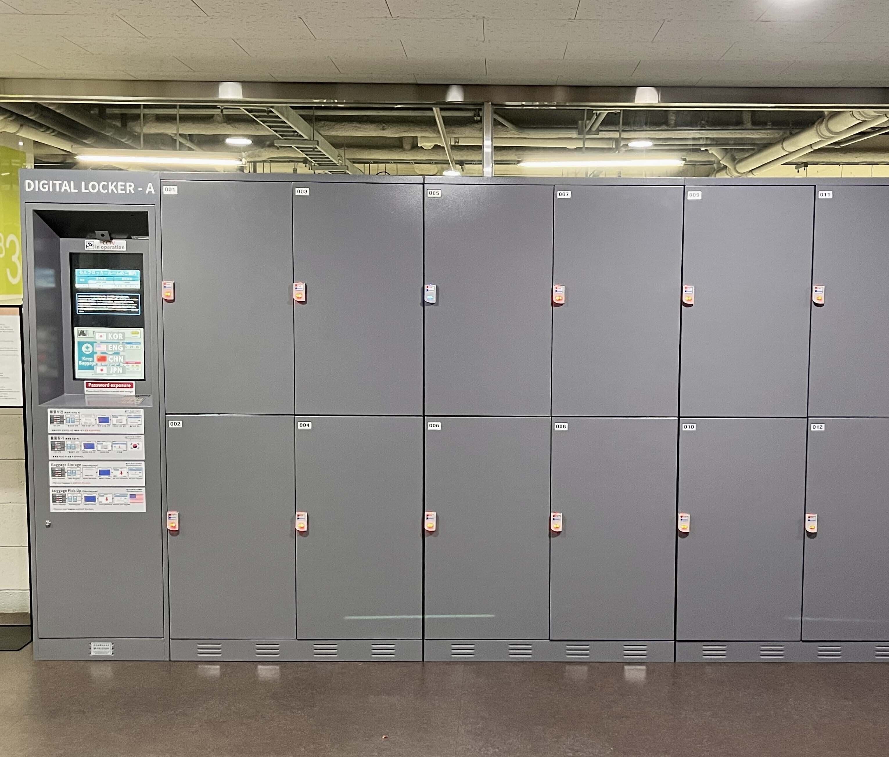 A row of grey lockers with a digital locker system on the left.