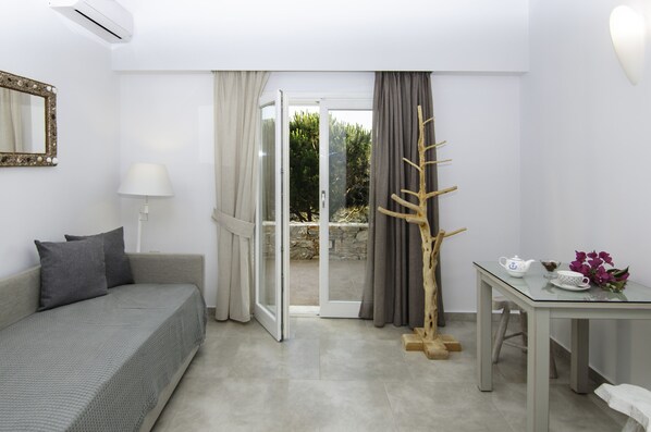 Quadruple Room, Sea View | Living area | Flat-screen TV - Skopelitis Village (Amorgos)