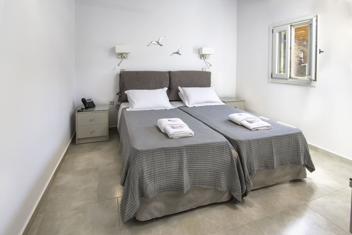 Quadruple Room, Sea View | Premium bedding, in-room safe, desk, blackout drapes