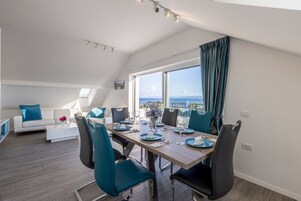 Luxury Penthouse, Sea View, Oceanfront | Living area | Flat-screen TV, toys