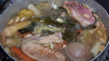 A pot of stew with various vegetables and meat.