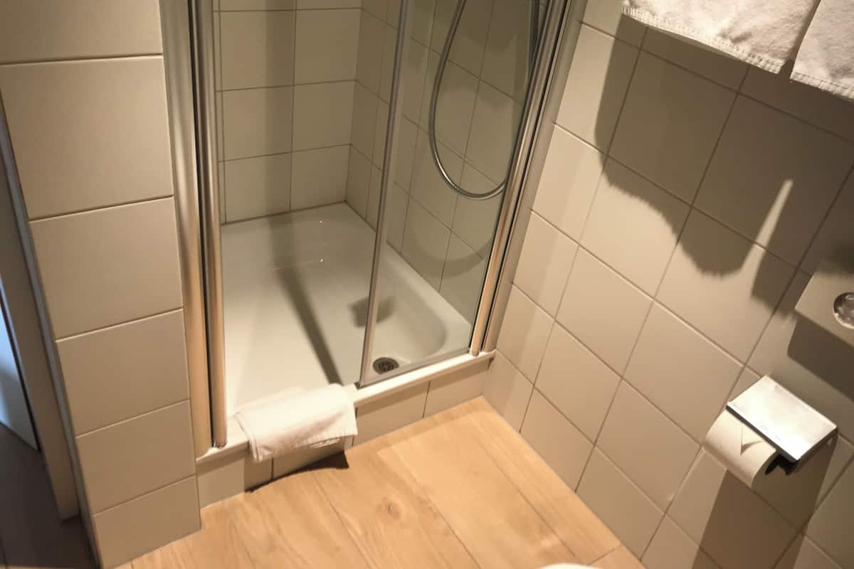 shower, rainfall showerhead, hair dryer, heated floors