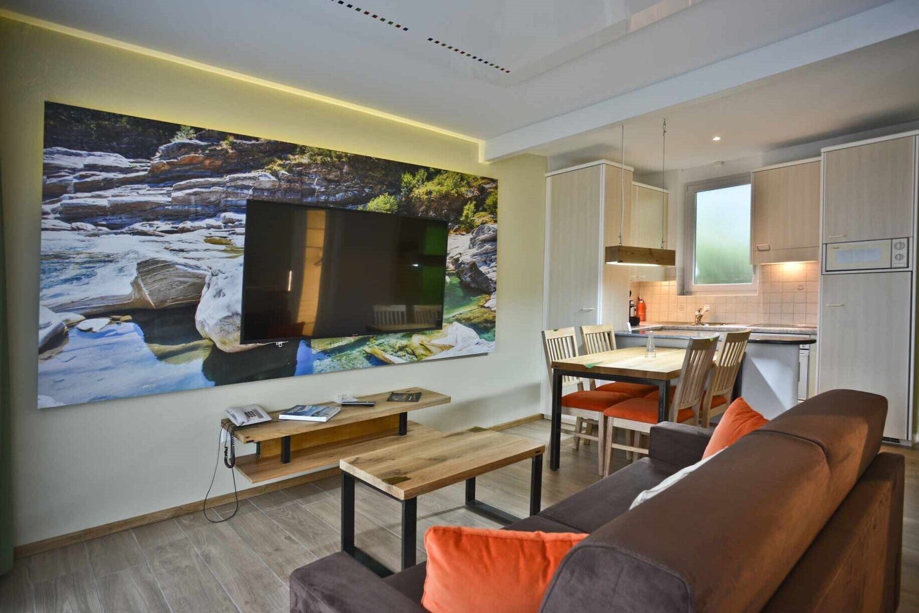 comfort studio | living area | 65-inch flat-screen tv with cable channels, tv, table football