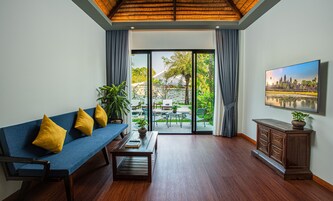 Family Suite, Private Pool | Living area | 52-inch LCD TV with cable channels, TV, fireplace