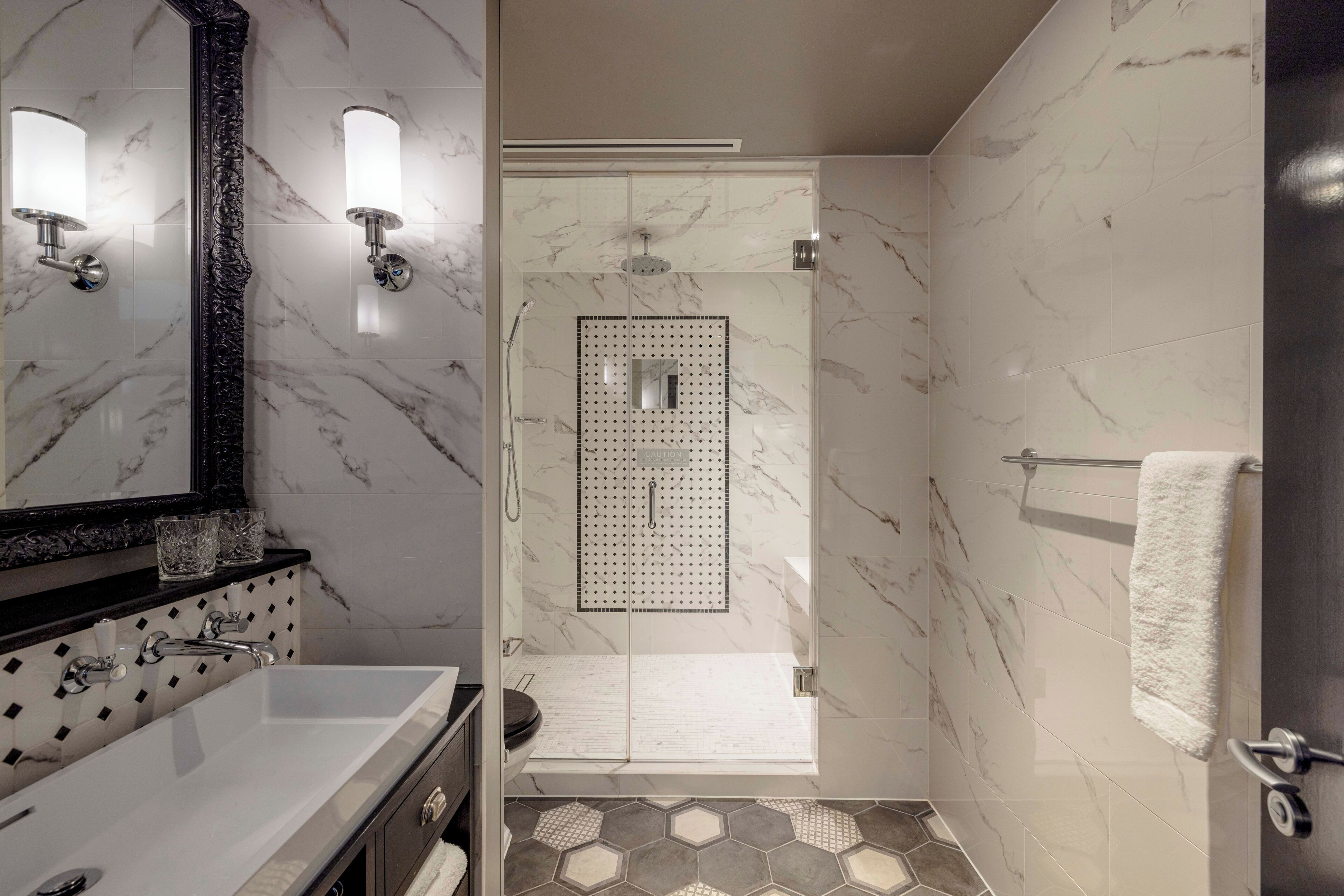 shower, rainfall showerhead, designer toiletries, hair dryer