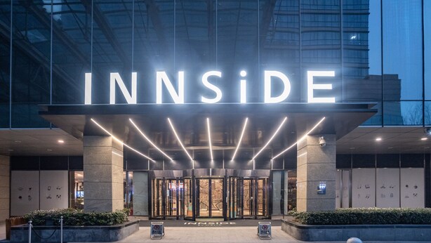 The entrance to a hotel with a prominent 'INNSIDE' sign, a glass facade, and a modern design. - INNSiDE by Meliá Zhengzhou (Zhengzhou)