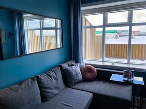 Deluxe Apartment, 1 Bedroom | Living area | 32-inch flat-screen TV with digital channels, TV, Netflix - Bakki Hostel and Apartments (Eyrarbakki)