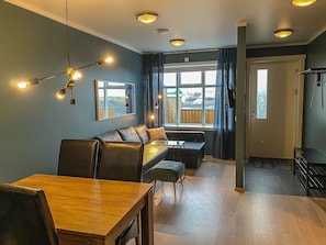 Deluxe Apartment, 1 Bedroom | Living area | 32-inch flat-screen TV with digital channels, TV, Netflix