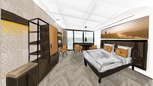 A modern bedroom with a bed, a TV, a sofa, and a desk. - Hotel Zwartewater (Zwartsluis)