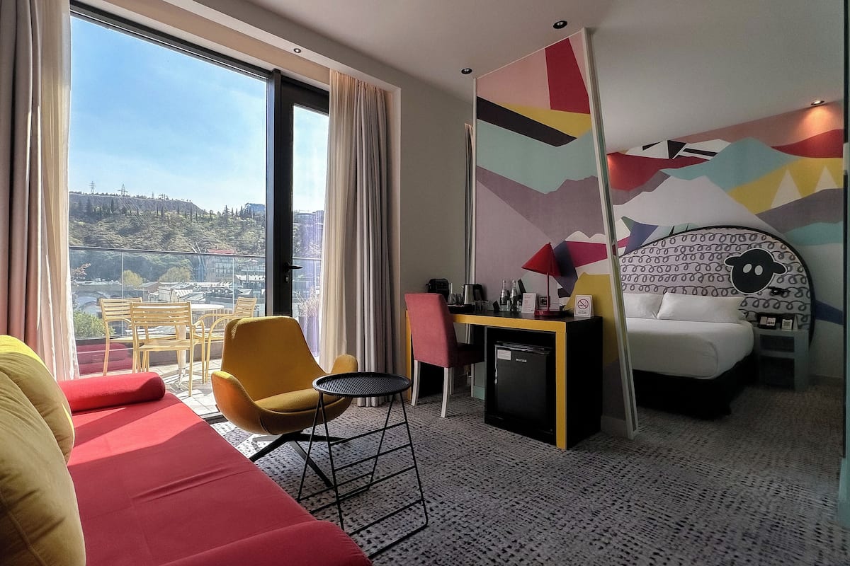 Suite, Balcony | 1 bedroom, premium bedding, minibar, in-room safe