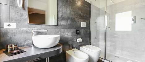 Designer toiletries, hair dryer, bidet, towels